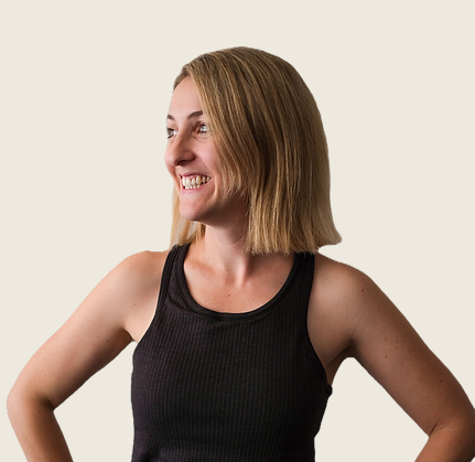 Smiling woman with blond hair looking away from camera.